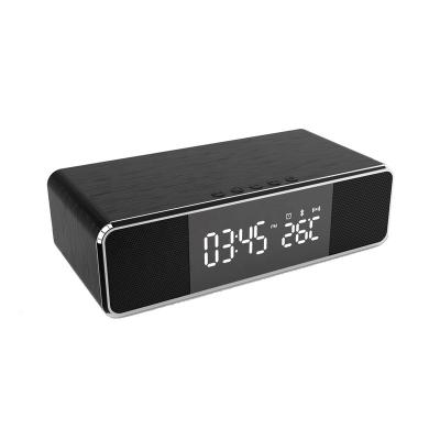 China Mobile Phone and USB Charging Device 4 in 1 FM Radio Wireless Charger Alarm Clock with Thermometer Date Display and Portable Wireless Speaker Built-in Microphone for sale