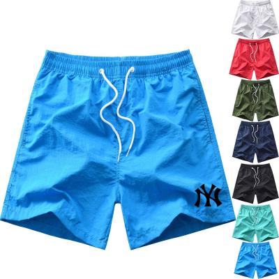 China Customized QUICK DRY logo mens lightweight nylon shorts with mesh liningmens beach pants mens beach pants for sale