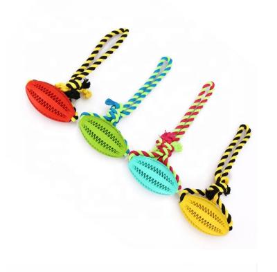 China Sustainable Rubber Dog Chewing Teeth Ball Toy Training Pet Toy With Rope for sale