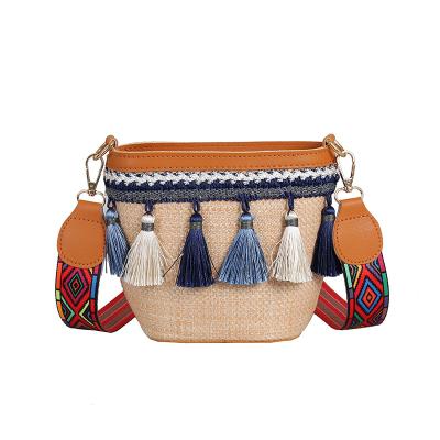 China Fashion Bag Handle Shoulder Bag Sand Reed Woven Women Top Tote With Tassels for sale