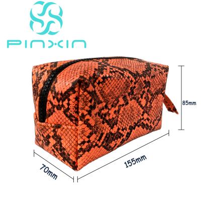 China Fashoion factory design OEM/ODM orange python print skin snake travel bag makeup cosmetic bag for sale