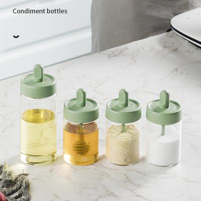 China Dropshipping Bpa Free Viable Clear Salt Bottle Glass Shaker Bottle Jam Spice Jar Seasoning Container With Spoon Brush for sale