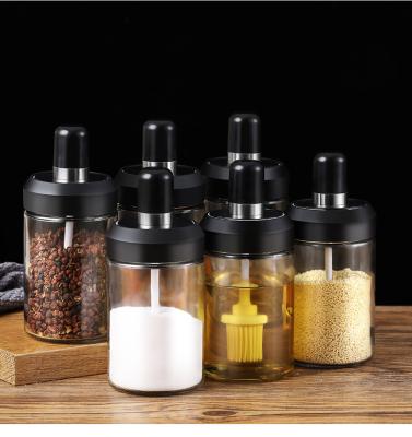 China Viable Bpa Free Clear Salt Bottles Glass Shaker Bottle Jam Spice Jar Seasoning Container With Spoon Brush for sale