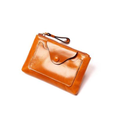 China Factory price waterproof hot sale vintage mini key purse genuine leather thin wallet for women for sale