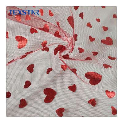 China Sustainable Hot Stamping Heart Foil Diamond Tulle Mesh Fabric For Dress for sale