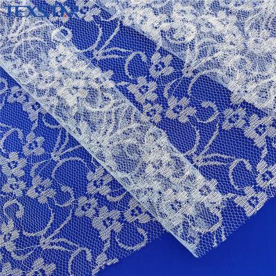 China Soft Polyester Jacquard Fashion White Tulle Lace Fabric For Wedding Dress for sale