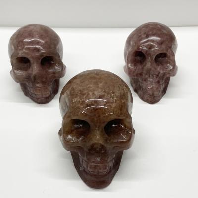 China China Hot Selling High Quality Natural Quartz Crystal Skulls Red Strawberry Crystal Human Head Bone For Fengshui for sale