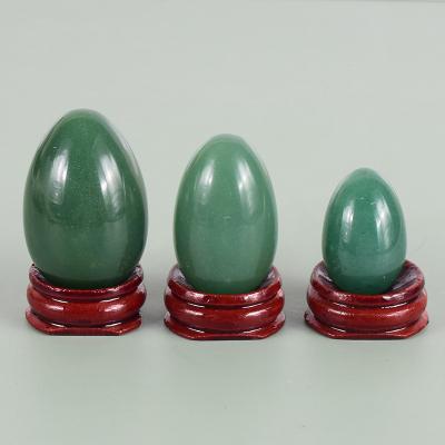 China China Hand Carved Crystal Green Aventurine Egg Natural Quartz Yoni Egg With Wooden Base Undrilled for Women Healing for sale