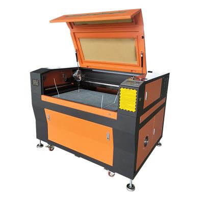 China Laser CUTTING SUKE Brand 9060 Electric CNC Laser Cutter For Fabric for sale