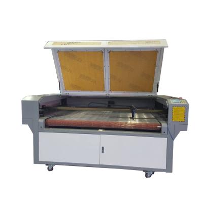 China Water Cooled Auto-feeding Laser Cutting New Design 100 Watt Laser Machine For PVC Wood Acrylic for sale