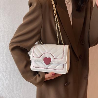 China New Fashion PU Leather Causal Cross - Body Bag Women Solid Color Heart Chain Shoulder Bag for sale