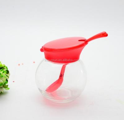 China Viable Wholesale Clear Glass Salt Shaker With Cover And Spoon Colorful Plastic High Quality Kitchenware for sale