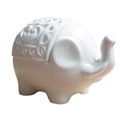 China Home Decoration Nordic Style Creative Hot Selling Ceramic Hollow Elephant Shape Candle Holder Candlestick Home Decoration for sale