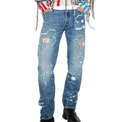 China Man's Patchwork Pattern Biker Damage Jeans Casual Denim Pants Breathable Blue Ripped Jeans For Men for sale