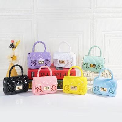 China 2023 Summer Girl Handbag Indoor Home Outdoor Beach Kids Mini Small Jelly Beach Bolso Hollow Coin PVC Tote Bags Jelly Bags For Women for sale