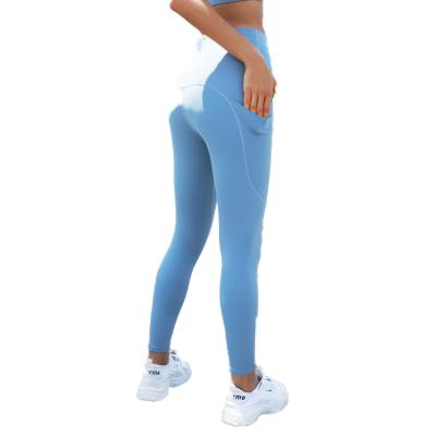 China New pocket hip peach high waist high waisted women's running pants fitness yoga clothes breathable elastic sports pants quick-drying for sale