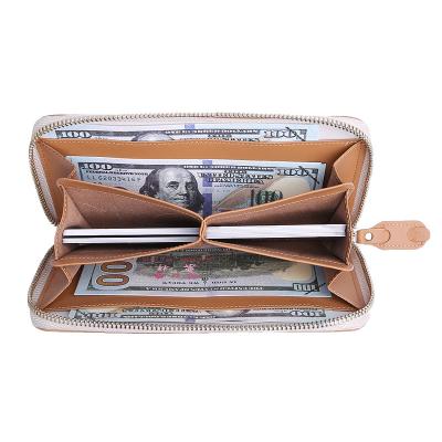 China RFID hotselling high capacity long zipper wallet genuine leather wallet for women RFID safe for sale