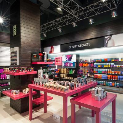 China red style cosmetics shop interior design with cosmetics cabinet customized pink cosmetic shop design for sale