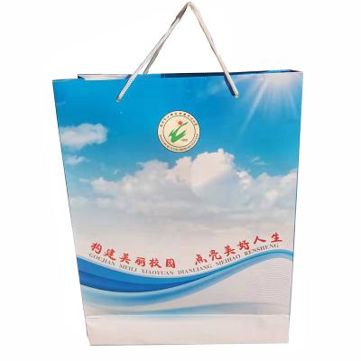 China Hard Square Shape Custom Printed Recyclable Packaging Art Paper Bag With Handle for sale