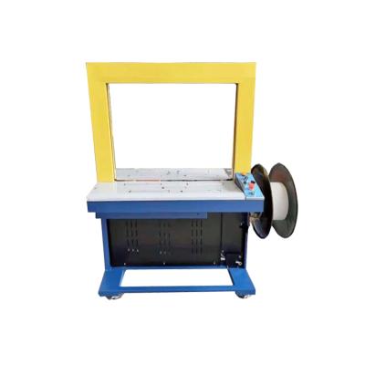 China Automatic Food Box Crate Cardboard Strapper Strapping Machine for sale