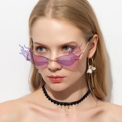 China Fashion Sunglasses 2022 Famous Brands Luxury Designer Party Rimless Sunglasses Wholesale Fashion Fire Cat Eye Sun Glasses Woman for sale