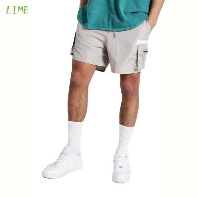 China Summer Streetwear Breathable Drawstring Pocket Sweated White 100% Polyester Men Shorts Logo Men Summer Cargo Shorts Custom Made for sale