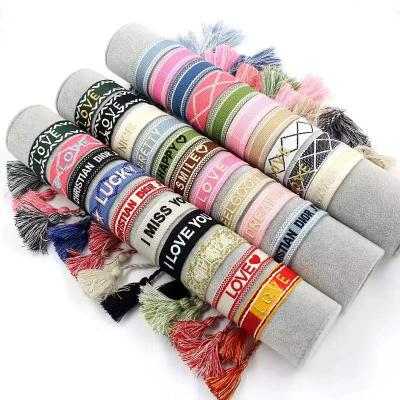 China Handmade Vintage Cotton Rope Braided Adjustable Bracelet Pattern Arm AccessoriesTassels Bohemian Fashionable Embroidered Wholesale for sale