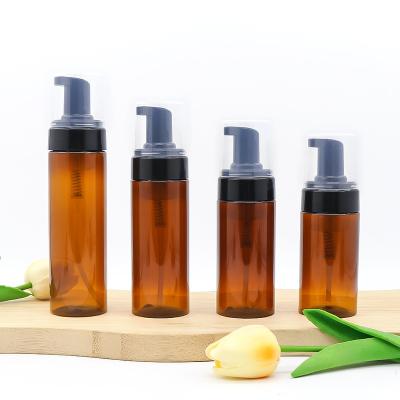 China Cosmetic custom logo cosmetic pump bottle empty PET facial cleanser mousse amber foam pump bottles for sale