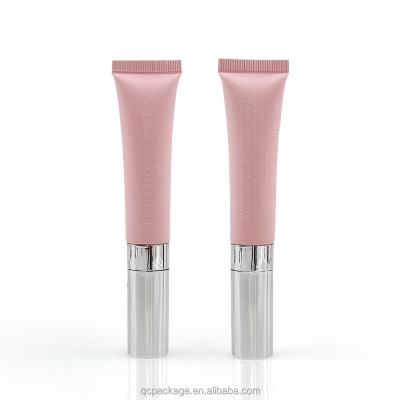 China Cosmetic Custom high quality unique lipgloss squeeze tube empty cosmetic tube pink 10g 15g 20g mental massage head lipgloss tube for sale