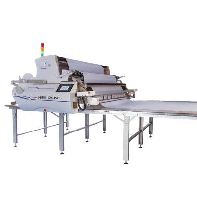 China Garment Shops Automatic Industrial Fabric Fastening Cutting And Gluing Spreading Spreading Machine for sale