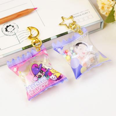 China Advertising Promotional Cartoon Anime Custom Acrylic Candy Bag Charms Plastic Inflatable Candy Key Chain Shakers for sale