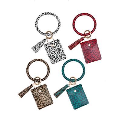 China Custom Anti-theft Leather Key Chain Bracelet Ring Wrist Credit Card Wallet PU Leopard Key Chain Tassel Key Chain for Women Girls for sale