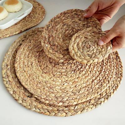 China Handmade Kitchen Rattan Coaster Set Place Mat Sea Grass Round Sustainable for sale