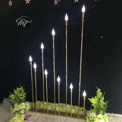 China Decoration Wedding Gold Centerpieces Road Lead Floor Sconce Candle Holder with 10 LED Bulb Head Light Beads for sale