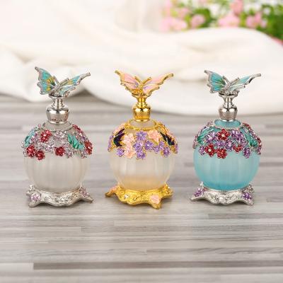 China Personal Care 30ml Metal Butterfly Empty Glass Perfume Bottles Refillable Essential Oil Attar Oil Bottle Factory Outlet#81107 for sale