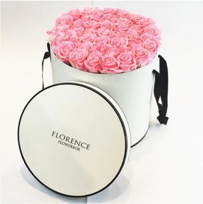 China Recyclable Custom Printed White Color Waterproof Aluminum Foil Round Flower Cardboard Box Storage Box With Lid Ribbon Handle for sale