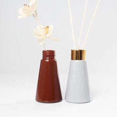 China Garment Wholesale 50ml 100ml150ml Empty Cone Bottles Glass Bottle With Metal Perfume Frost Personal Care Lid for sale