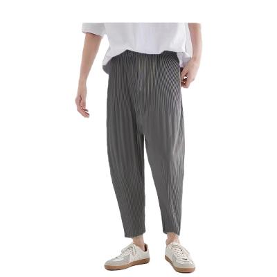 China Miyake high quality QUICK DRY pleated mens clothing loose elastic waist casual harem pants pleated pants men for sale