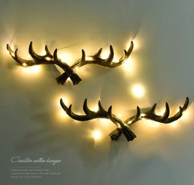 China Europe SIZE PROMOTIONAL WALL MOUNTED LITTLE LONG HOUSE WALL MOUNTED LIGHT RESIN LED LIGHT TREE BRANCH DEER HORN DESIGN HOOK DECORATIVE GIFT for sale