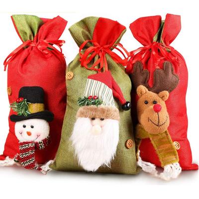 China Folding Bags Drawstring Christmas Bags Design 3D Fabric Christmas Gift Bags In Bulk for sale