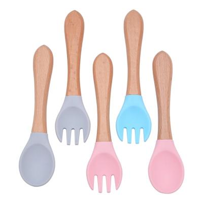 China Spoons and Fork with BPA Free Hot Sale Silicone Baby Handle Wooden Training Spoon and Fork with Soft Curved Silicone Tips for Toddlers for sale