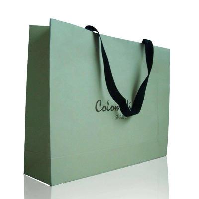 China Recycled Materials Wholesale Printed Gift Shopping Paper Bags Customized Ribbon Luxury Handle Tote Paper Bags With Logo for sale