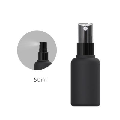 China 50ml 120ml Mini Round Empty Matte Black Plastic Mist Spray Cosmetic Bottle for sale