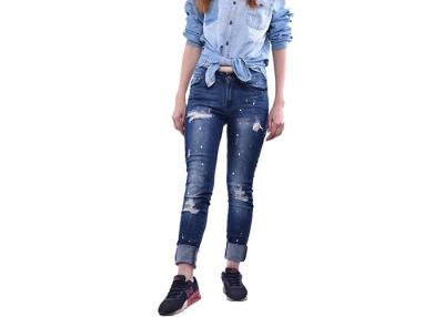 China Ladies Skinny Shredded Jeans , Elastic Slim Fit Jeans Destroy Painted Printed for sale