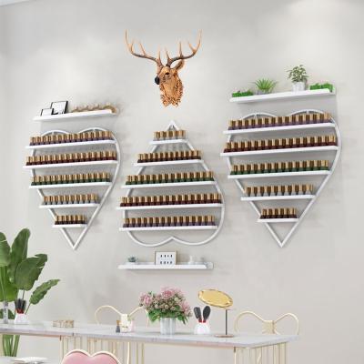 China Fashionable Professional Salon Furniture Metal Wall Showcase Of Nail Polish Shelves for sale