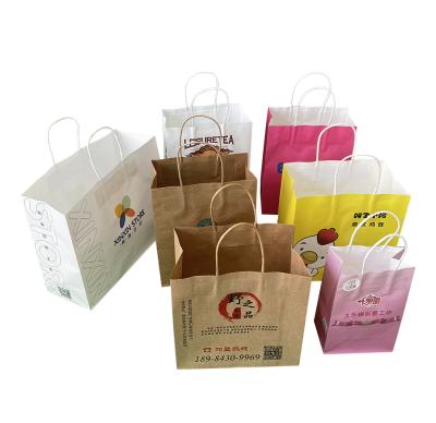 China Recycled Kraft Paper Bags Custom Paper Packaging Materials Square Bag With Handle Paper Bag For Clothes for sale