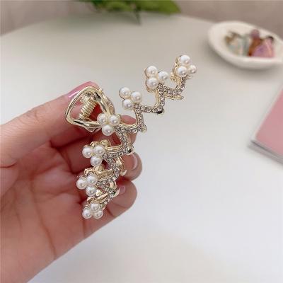 China Beautiful 2021 Korean Fashional rhinestone pearl haipin hair accessories fishtails bow hair catching hair clips for girl for sale