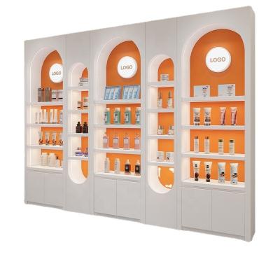 China Man-made board Beauty salon cosmetics display cabinet paint simple modern special-shaped showcase skin care nail polish display cabinet for sale