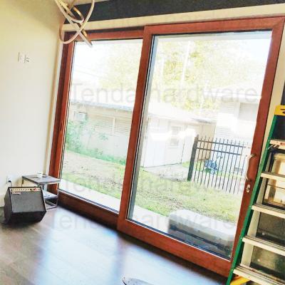 China Heat Insulation Wood Clad Aluminum Sliding Door With Low-E Glass for sale