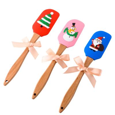 China Stocked Mixing Scraper, Christmas Gift W Handle Santa Silicone Butter Cream Spatula Wooden Kitchenware Baking Tools for sale